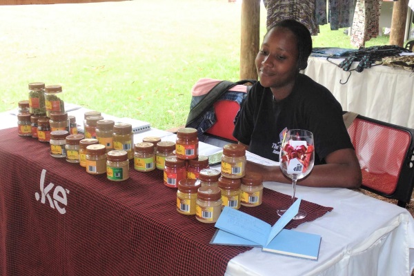 Sales Rep Sharon manning The Vine Eateries' table at WeCreate Market
