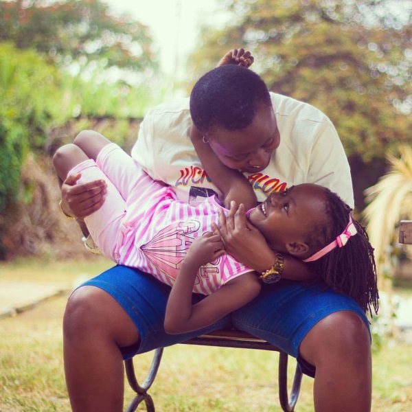 Liz Kilili playing with her daughter